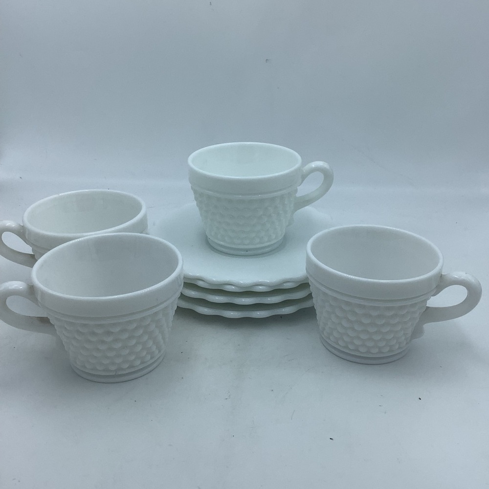 Four White Hobnail Cups and Saucers